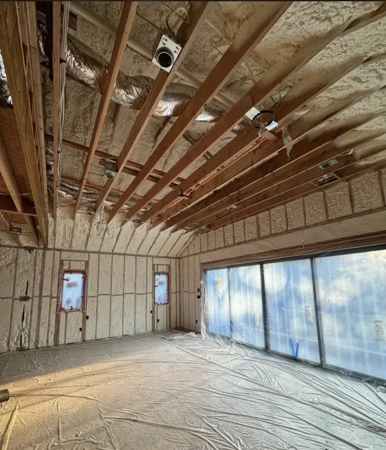 Interior walls and ceiling insulated with spray foam during new construction in South Whitehall